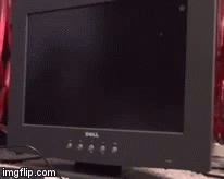 A Dell Computer Monitor Sitting On A Desk GIF