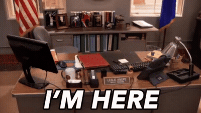 A Desk With A Computer And The Words I 'M Here On It GIF
