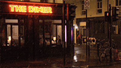 A Diner With A Neon Sign That Says The Diner On It GIF