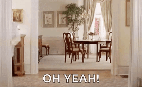 A Dining Room With A Table And Chairs And The Words `` Oh Yeah '' Written On The Bottom . GIF