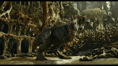 A Dinosaur Is Walking Through A Cave With A Lot Of Trees GIF