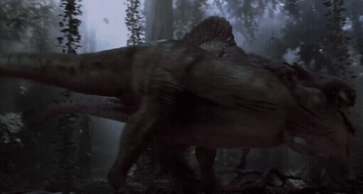 A Dinosaur Is Walking Through A Dark Forest With Trees In The Background GIF