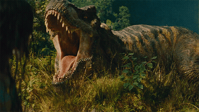A Dinosaur With Its Mouth Wide Open Standing In The Grass GIF