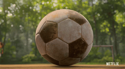 A Dirty Soccer Ball Is On A Wooden Table With Netflix Written On The Bottom GIF