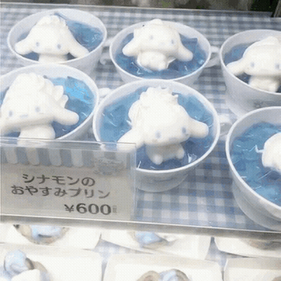 A Display Of Cinnamon Rolls In Cups With A Price Tag Of 600 Yen GIF