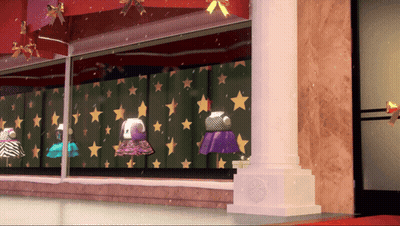 A Display Of Dresses In A Store Window With Stars On The Wall GIF