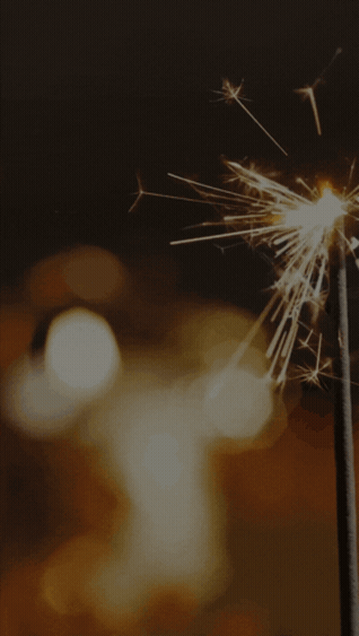 A Diwali Greeting Card With A Candle And Sparklers On It GIF