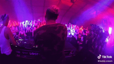 A Dj Playing Music In Front Of A Crowd With A Tiktok Watermark On The Bottom Right GIF