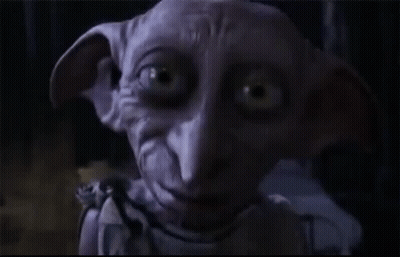 A Dobby From Harry Potter Says Hello In The Dark GIF