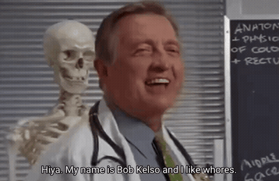 A Doctor Is Standing Next To A Skeleton And Smiling . GIF