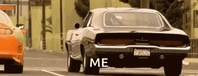 A Dodge Charger Is Parked Next To Another Car In A Parking Lot And Says `` Me '' . GIF