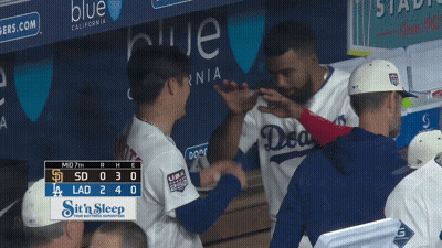 A Dodgers Baseball Player Shakes Hands With A Coach GIF