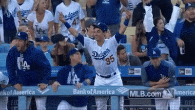 A Dodgers Baseball Player Stands In Front Of A Crowd GIF