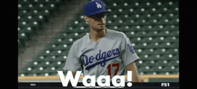 A Dodgers Baseball Player Wearing A Number 17 Jersey Stands On The Field GIF