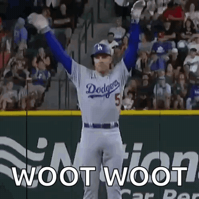 A Dodgers Baseball Player With His Arms In The Air GIF