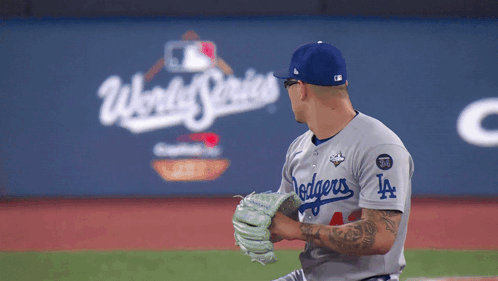 A Dodgers Pitcher Getting Ready To Throw A Baseball GIF