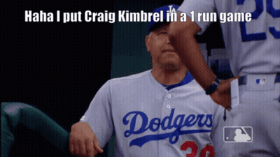 A Dodgers Player Is Getting A High Five From A Teammate GIF