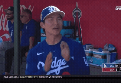A Dodgers Player Is Smiling In The Dugout GIF