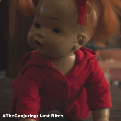 A Doll Is Crawling On The Floor With The Conjuring Last Rites Written Underneath It GIF
