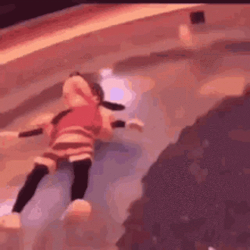A Doll Is Laying On The Ground In A Pool . GIF