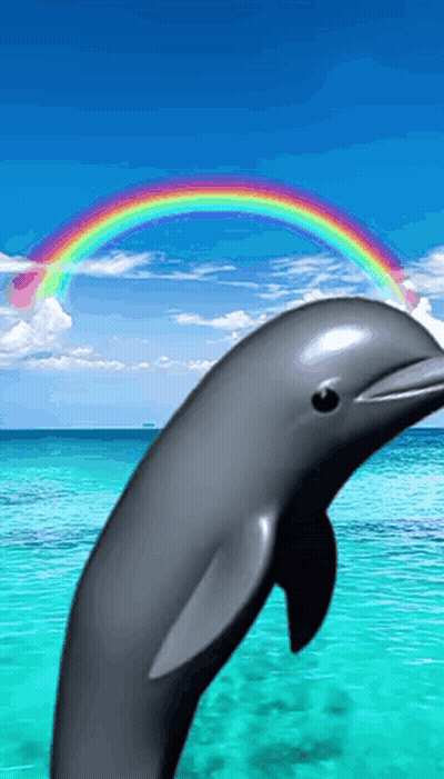 A Dolphin Jumping Out Of The Ocean With A Rainbow In The Background GIF