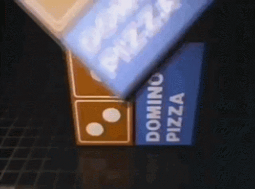 A Domino 'S Pizza Sign Is Lit Up At Night GIF