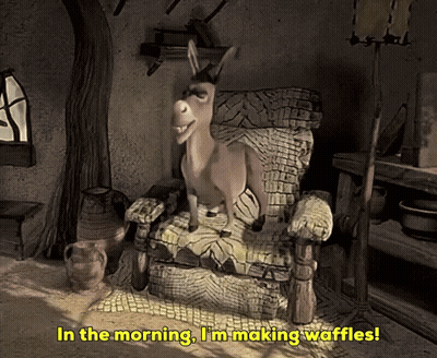 A Donkey Sitting In A Chair With The Words In The Morning I 'M Making Waffles Below It GIF