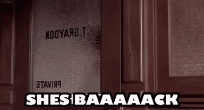 A Door With A Sign On It That Says She 'S Baaaack . GIF