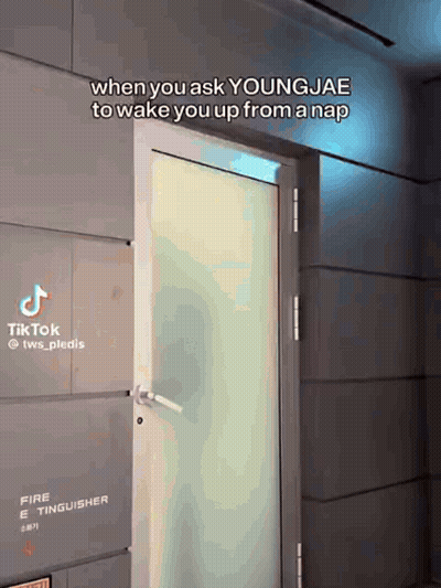 A Door With A Sign That Says Fire Extinguisher GIF