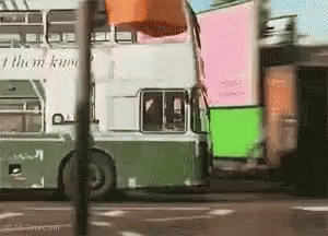 A Double Decker Bus That Says I Them Know On The Side GIF