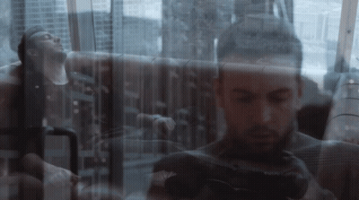 A Double Exposure Of A Man Taking A Picture With A Canon Camera GIF