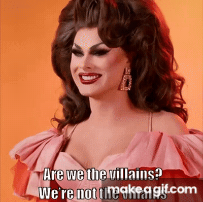 A Drag Queen In A Pink Dress Is Smiling And Says Are We The Villains We 'Re Not The Villains GIF