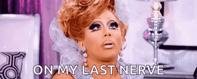 A Drag Queen Is Making A Funny Face And Saying `` On My Last Nerve '' In Front Of A Lamp . GIF