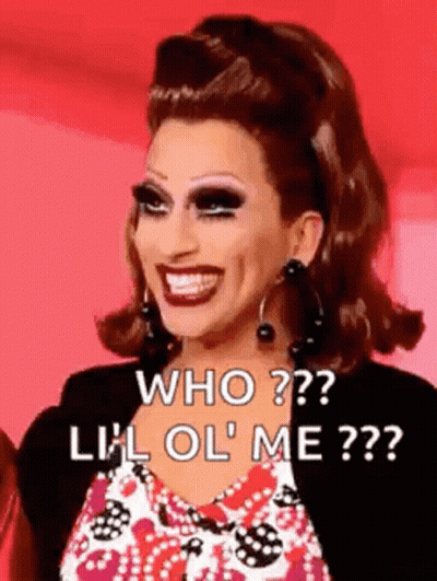 A Drag Queen Is Smiling And Asking Who ? Lil Ol ' Me ? . GIF