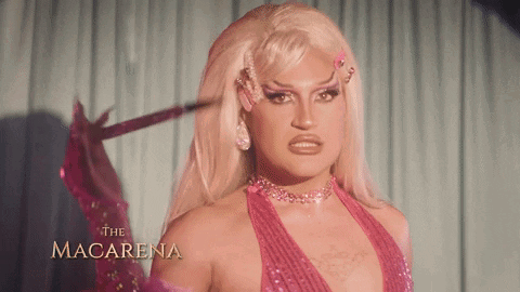 Drag Queen Macarena In Pink Dress With Sword GIF