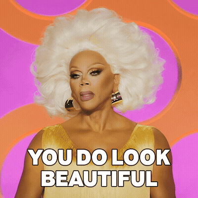 A Drag Queen Says You Do Look Beautiful On A Pink Background GIF