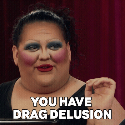 A Drag Queen Says " You Have Drag Delusion " In Front Of Her Face GIF