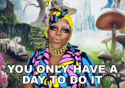 A Drag Queen Says " You Only Have A Day To Do It " In Front Of Alice In Wonderland Background GIF
