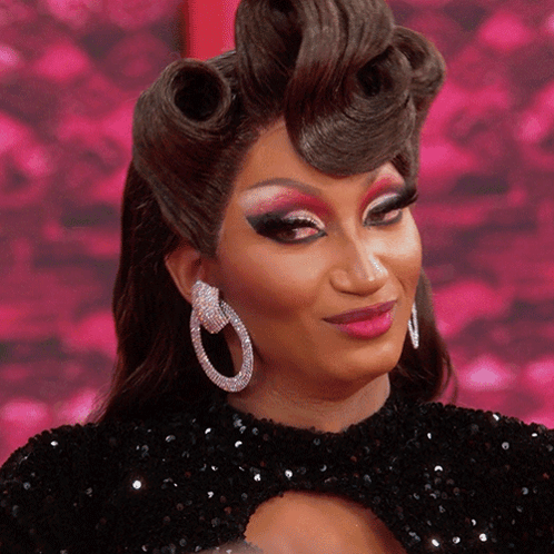 Drag Queen In Black Dress And Earrings GIF