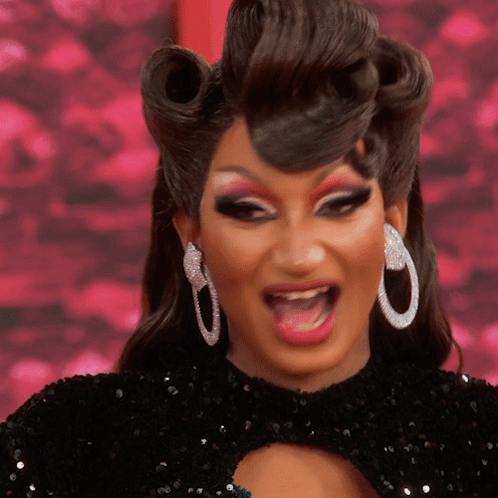 Drag Queen Making Funny Face With Hoop Earrings GIF