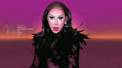 A Drag Queen With Her Tongue Hanging Out Is On A Purple Screen GIF