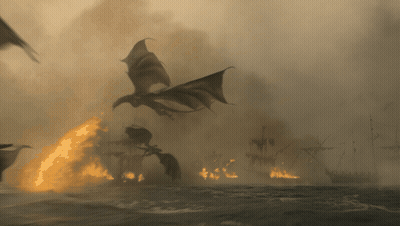 a dragon flying over a burning ship in the water