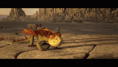 A Dragon From How To Train Your Dragon Is Crawling On A Rock GIF