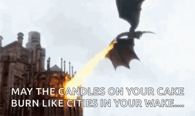 A Dragon Is Flying Over A Building With Flames Coming Out Of Its Mouth . GIF