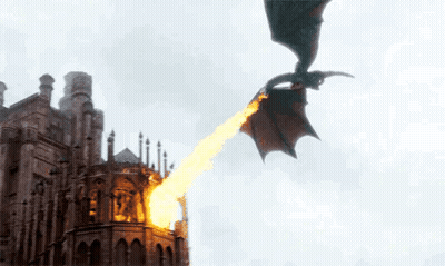 A Dragon Is Flying Over A Castle With Fire Coming Out Of It 'S Mouth . GIF