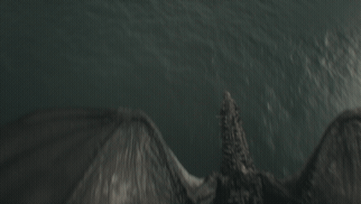 A Dragon Is Flying Over The Ocean With Its Wings Spread GIF