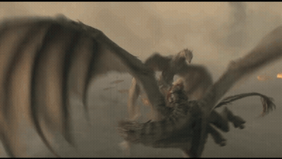 A Dragon Is Flying Through The Air While A Man Is Riding On Its Back . GIF