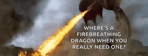 A Dragon Is Flying Through The Air With A Flame Coming Out Of It . GIF
