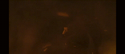 a dragon is flying through the air with flames coming out of it 's mouth