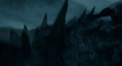 A Dragon Is Flying Through The Air With Its Wings Outstretched GIF
